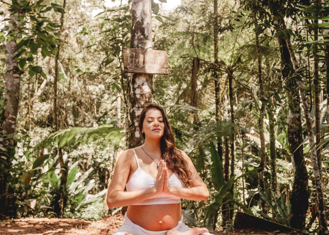 Expectant mother sitting outdoors