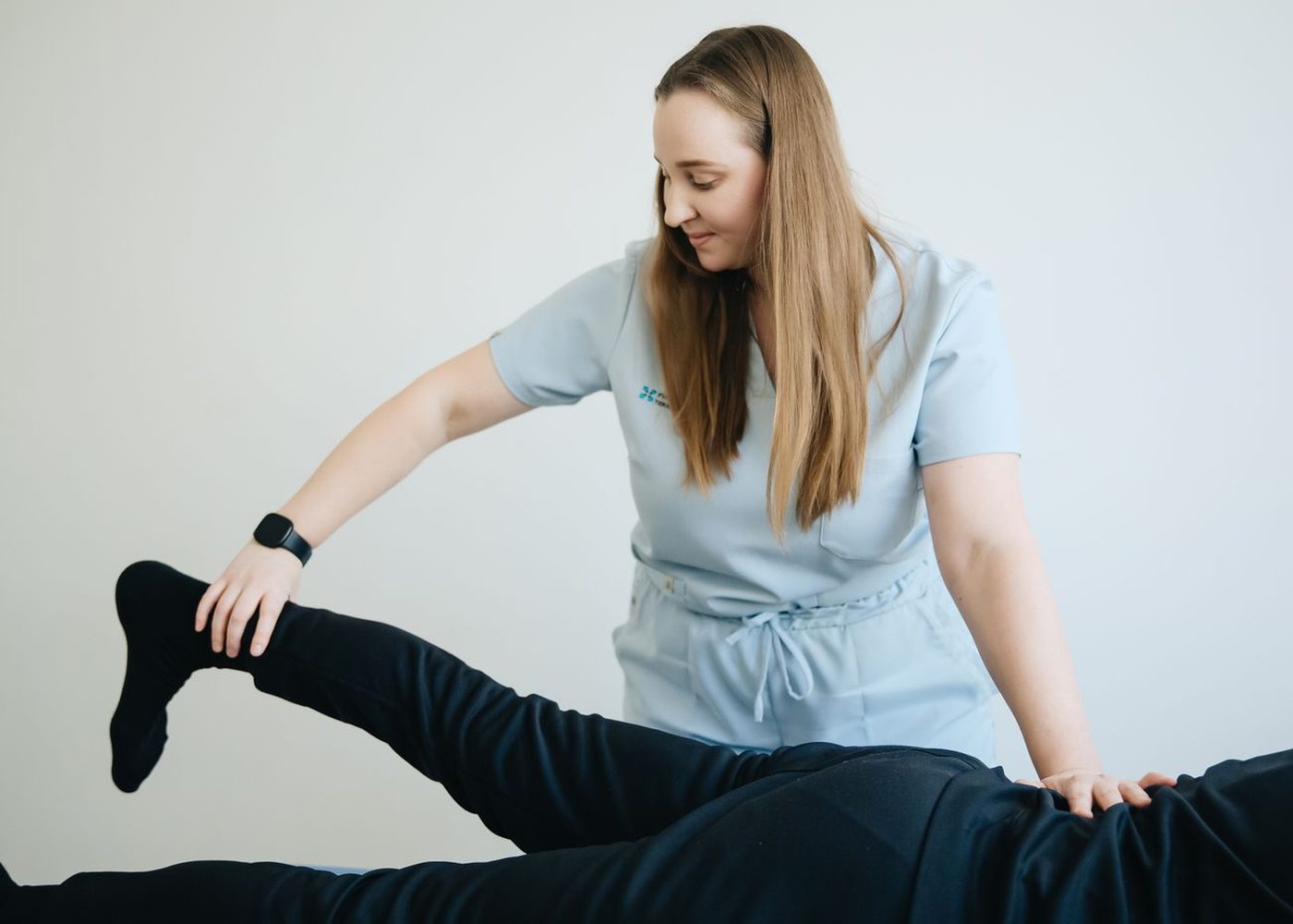 Practitioner assessing a patient's range of motion