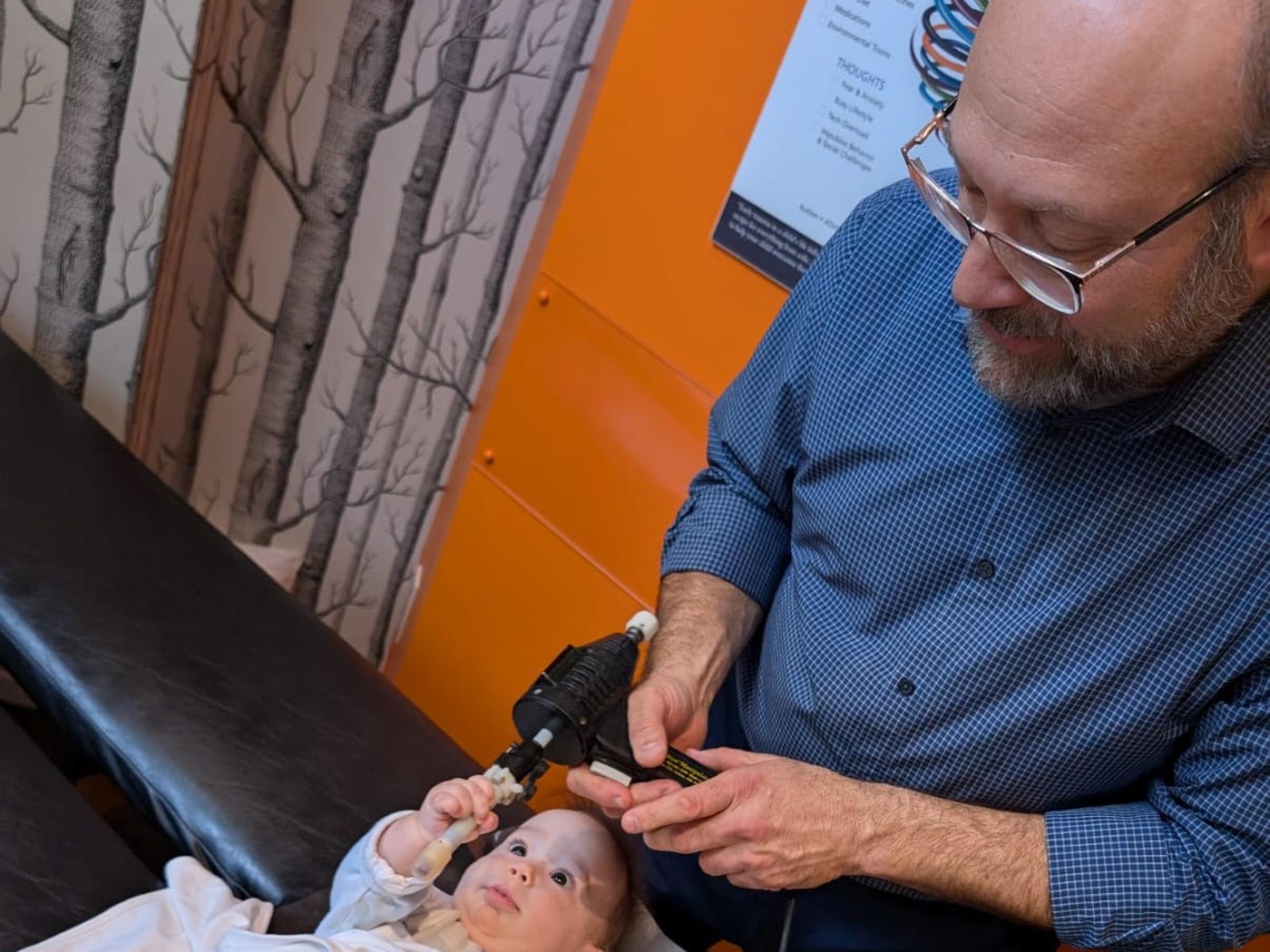 Dr. Aaron Weitz delivering an adjustment with the Integrator at the clinic