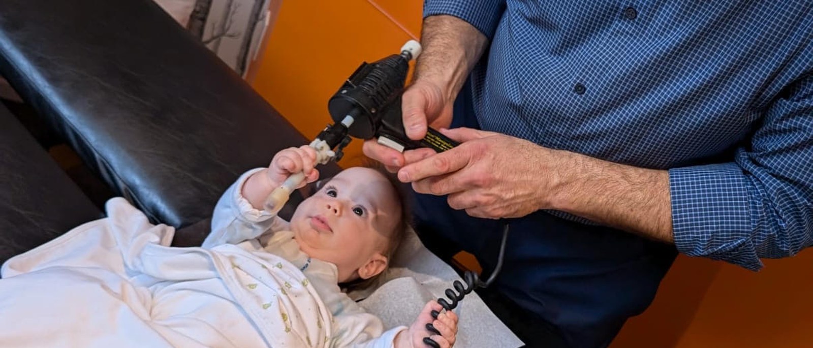 Dr. Aaron Weitz delivering an adjustment with the Integrator at the clinic